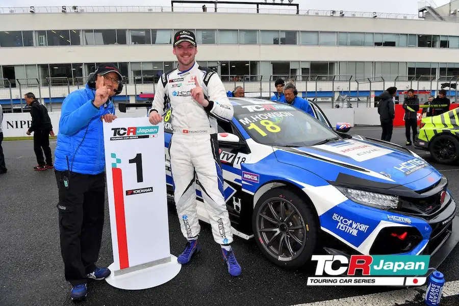 The first TCR Japan winner Matt Howson next to his KCMG Honda