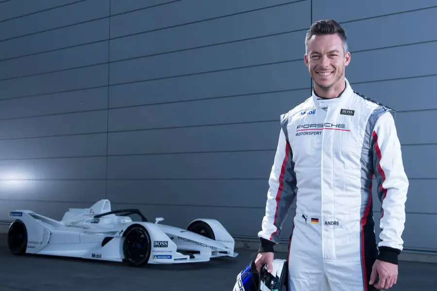 Andre Lotterer next to Porsche Formula E racecar