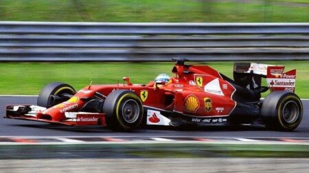 A Red Ferrari F1 Car Racing